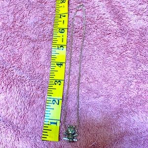 Vintage Avon little girl on swing necklace